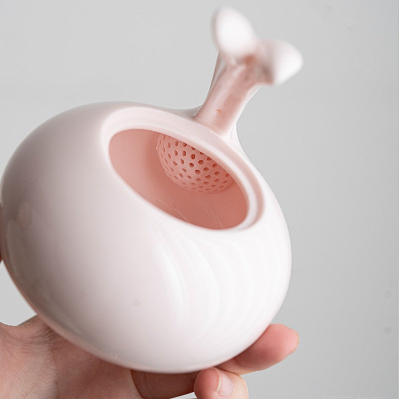 Porcelain pink teapot with cute bunny