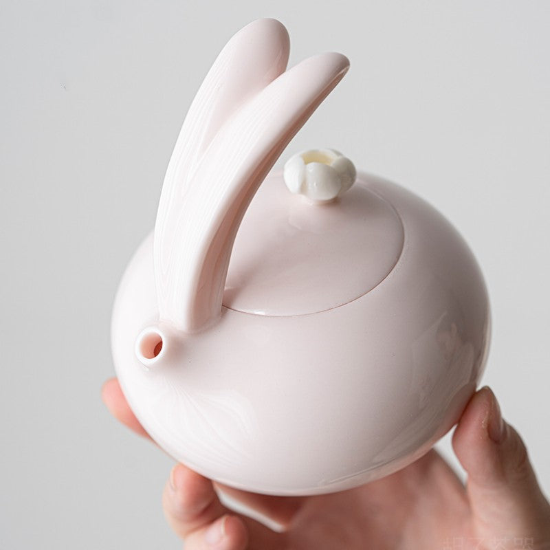 Porcelain pink teapot with cute bunny